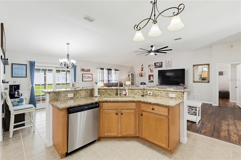 3497 Chadwick Avenue Spring Hill, FL 34609 - Photo 8 of 47 a kitchen with cabinets a sink and appliances