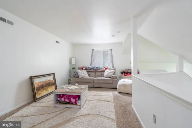 a living room with furniture and a couch