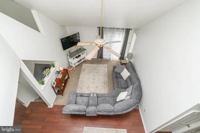 a view of living room with furniture and a fireplace
