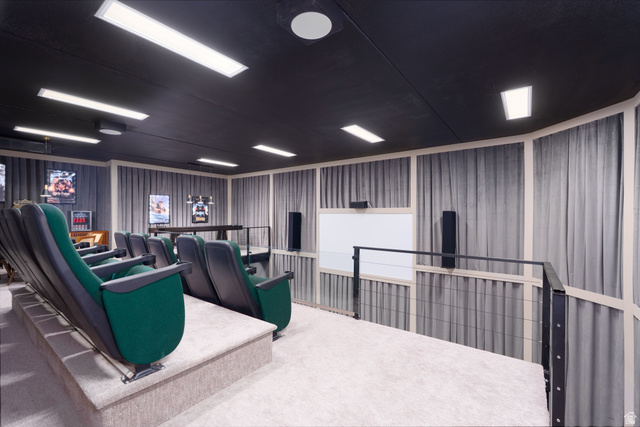 687 South 2080th Street East Springville, UT 84663 - Photo 41 of 149 Dedicated media room featuring tiered seating, a large projection screen, recessed ceiling lighting, and sound-absorbing wall treatments