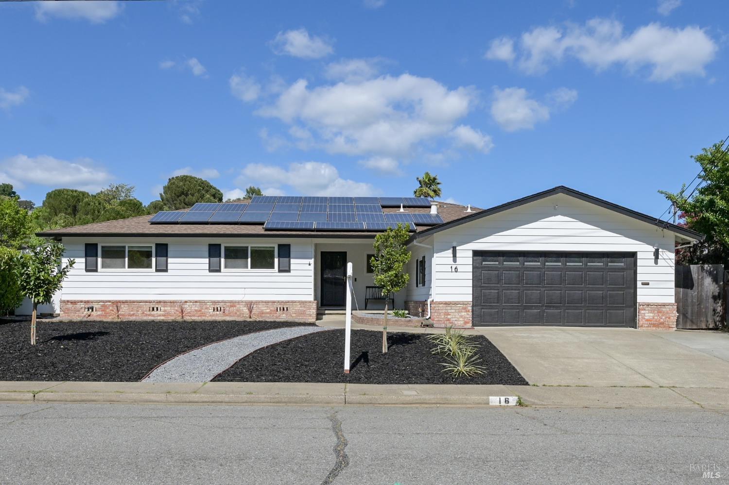 a front view of a house with yard