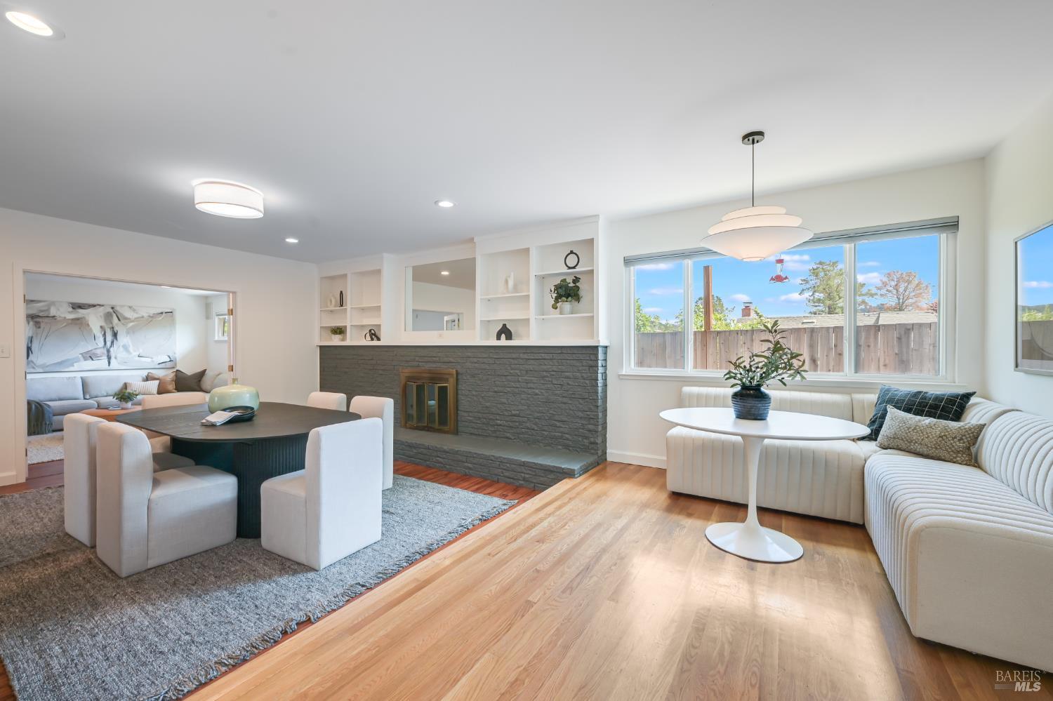 16 Wallace Way San Rafael, CA 94903 - Photo 13 of 44 a living room with furniture a table and kitchen view