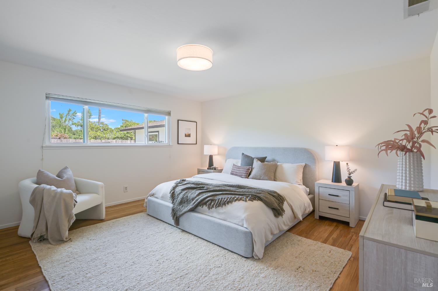 16 Wallace Way San Rafael, CA 94903 - Photo 23 of 44 a spacious bedroom with a bed and a couch