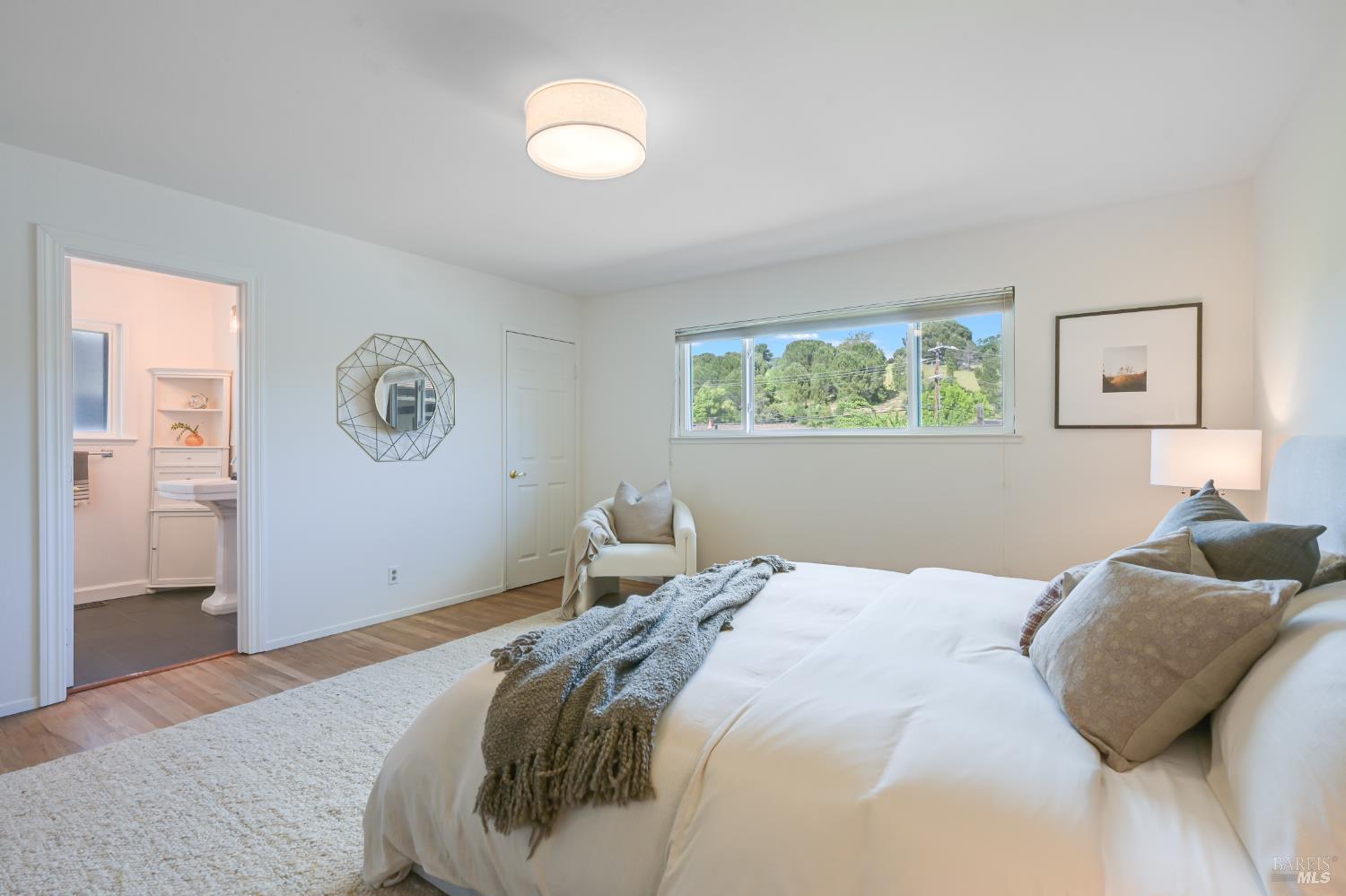 16 Wallace Way San Rafael, CA 94903 - Photo 24 of 44 a bedroom with a bed and painting on the wall