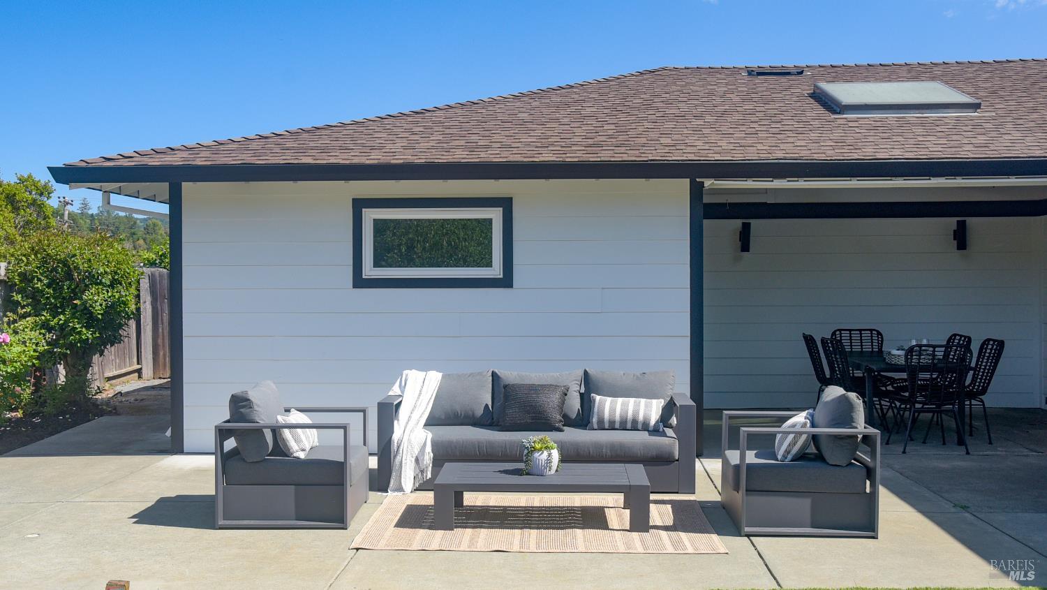 16 Wallace Way San Rafael, CA 94903 - Photo 35 of 44 a patio with couches table and chairs and potted plants