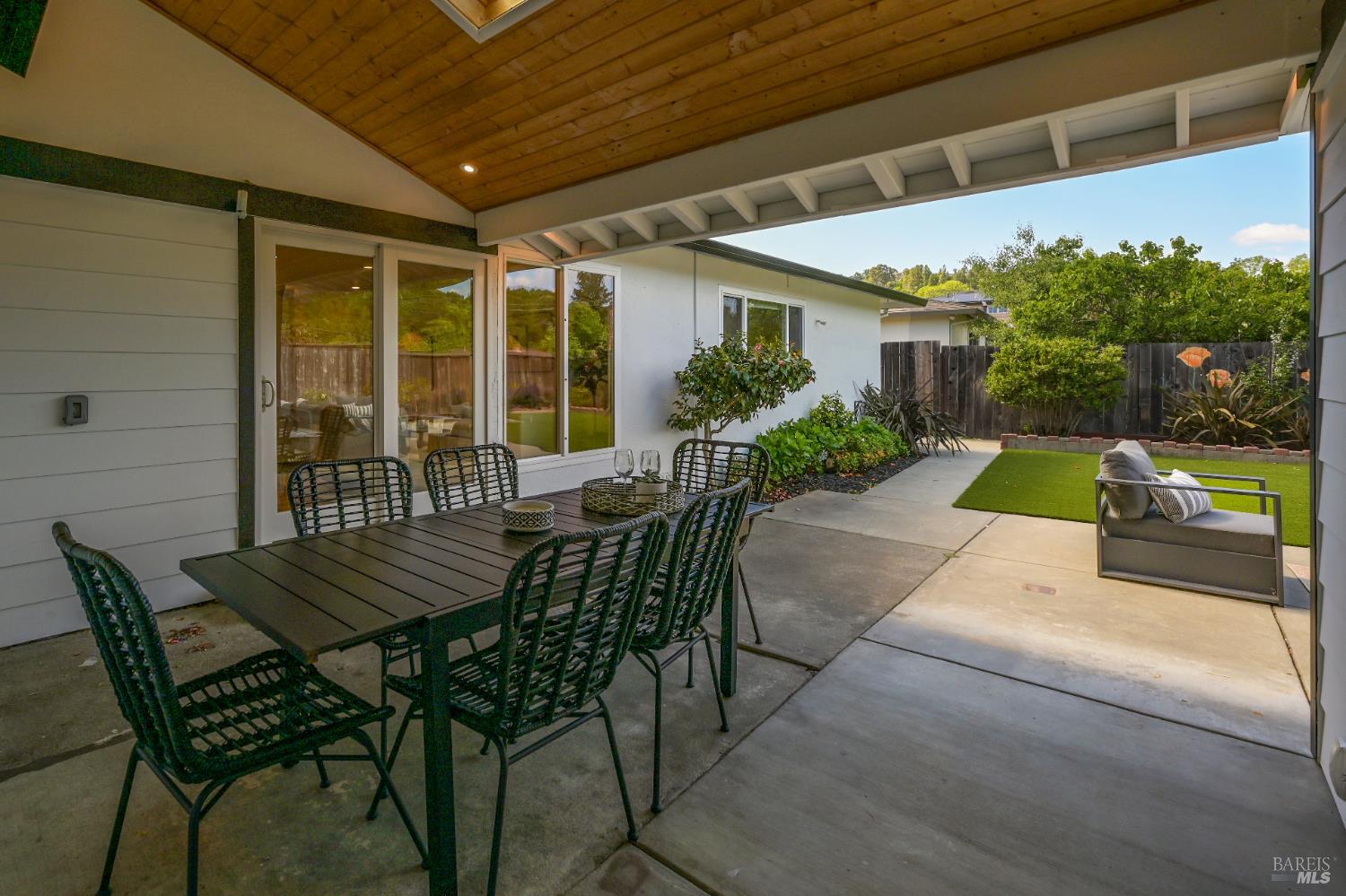 16 Wallace Way San Rafael, CA 94903 - Photo 36 of 44 a view of a patio with table and chairs and potted plants