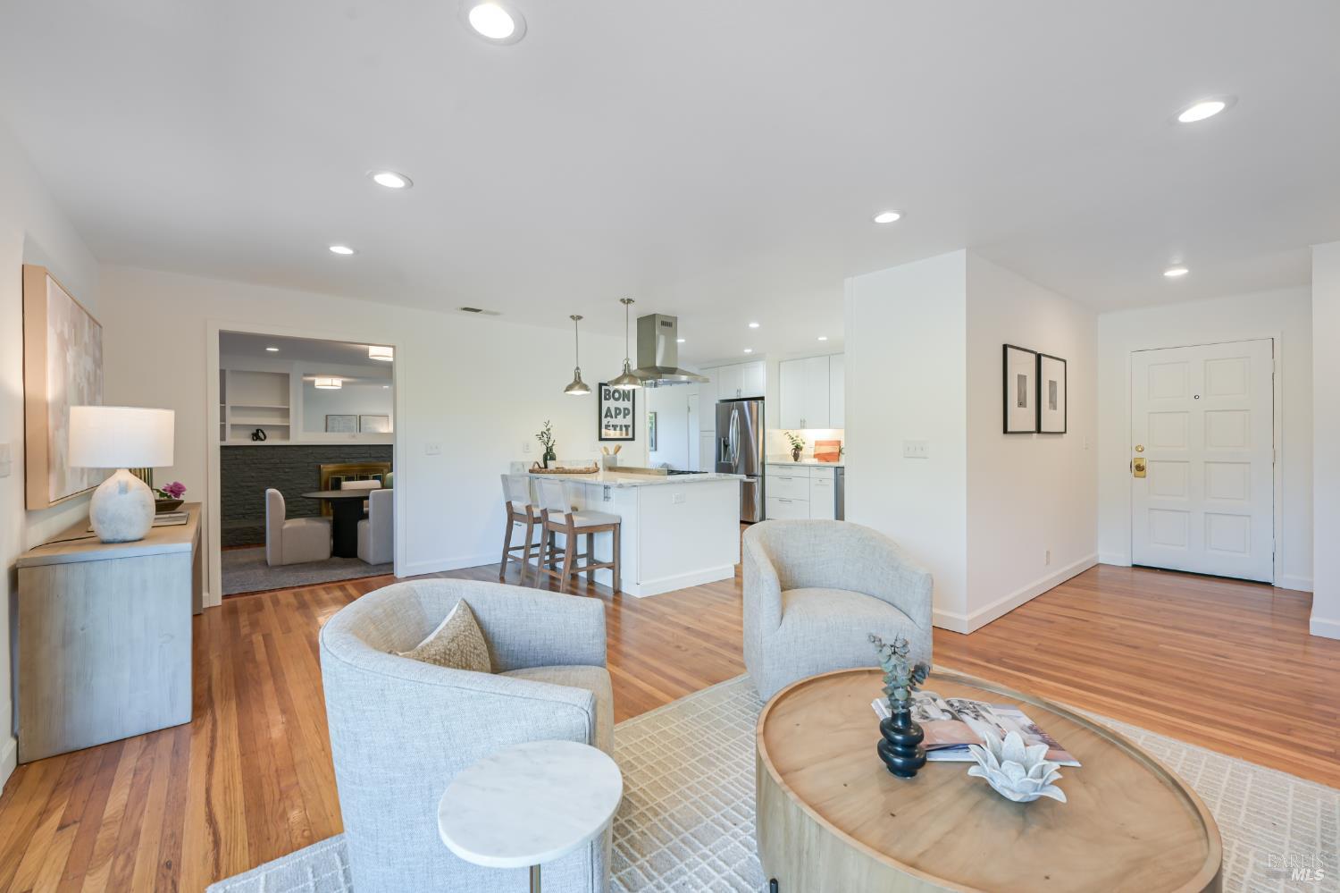 16 Wallace Way San Rafael, CA 94903 - Photo 8 of 44 a living room with furniture and a dining table with wooden floor
