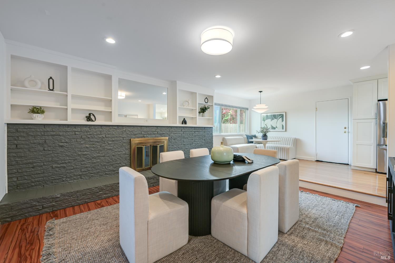 16 Wallace Way San Rafael, CA 94903 - Photo 10 of 44 a open kitchen with stainless steel appliances granite countertop a sink a stove a dining table and chairs