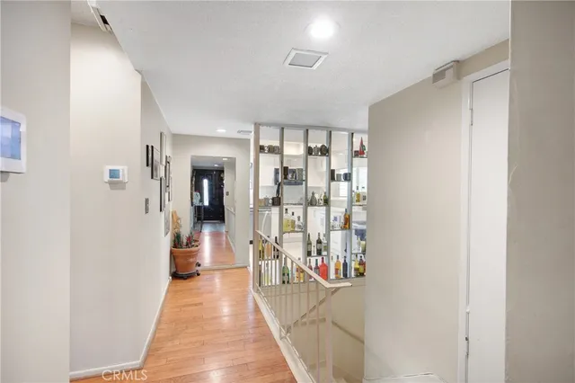a view of a walk in closet and bathroom