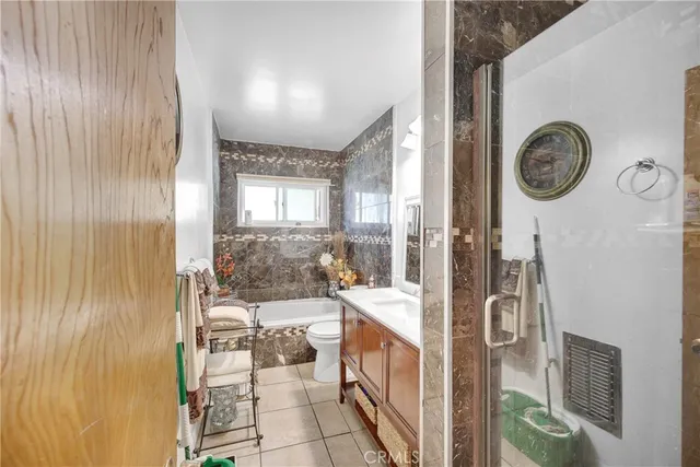 a living room with furniture and floor to ceiling window