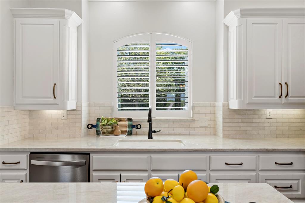 5000 Stillhouse Road Paris, TX 75460 - Photo 11 of 40 a kitchen with a sink and a window