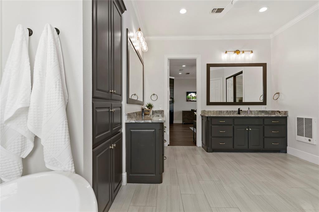 5000 Stillhouse Road Paris, TX 75460 - Photo 18 of 40 a bathroom with a granite countertop sink toilet and shower