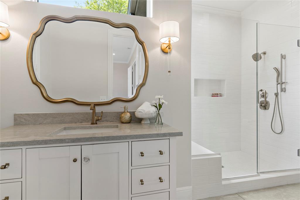5000 Stillhouse Road Paris, TX 75460 - Photo 21 of 40 a bathroom with a sink and a mirror