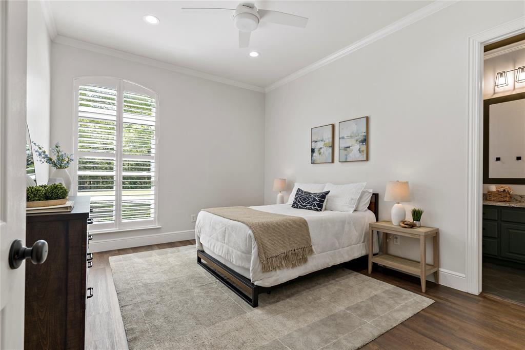 5000 Stillhouse Road Paris, TX 75460 - Photo 22 of 40 a spacious bedroom with a bed and a window