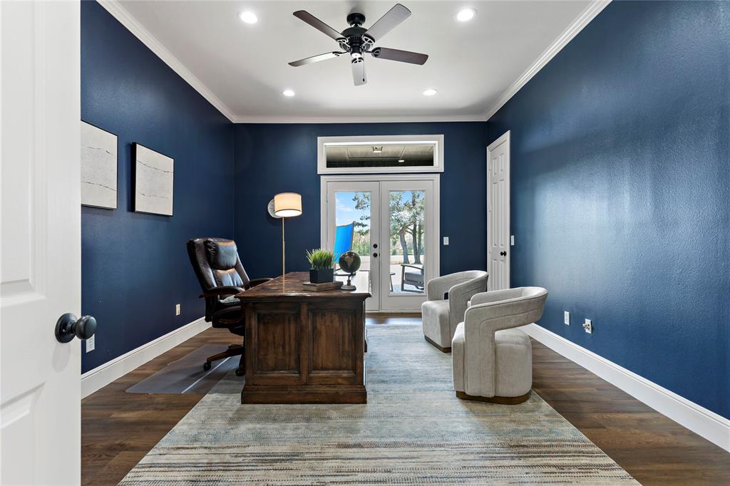 5000 Stillhouse Road Paris, TX 75460 - Photo 24 of 40 a living room with couches a fireplace and a potted plant