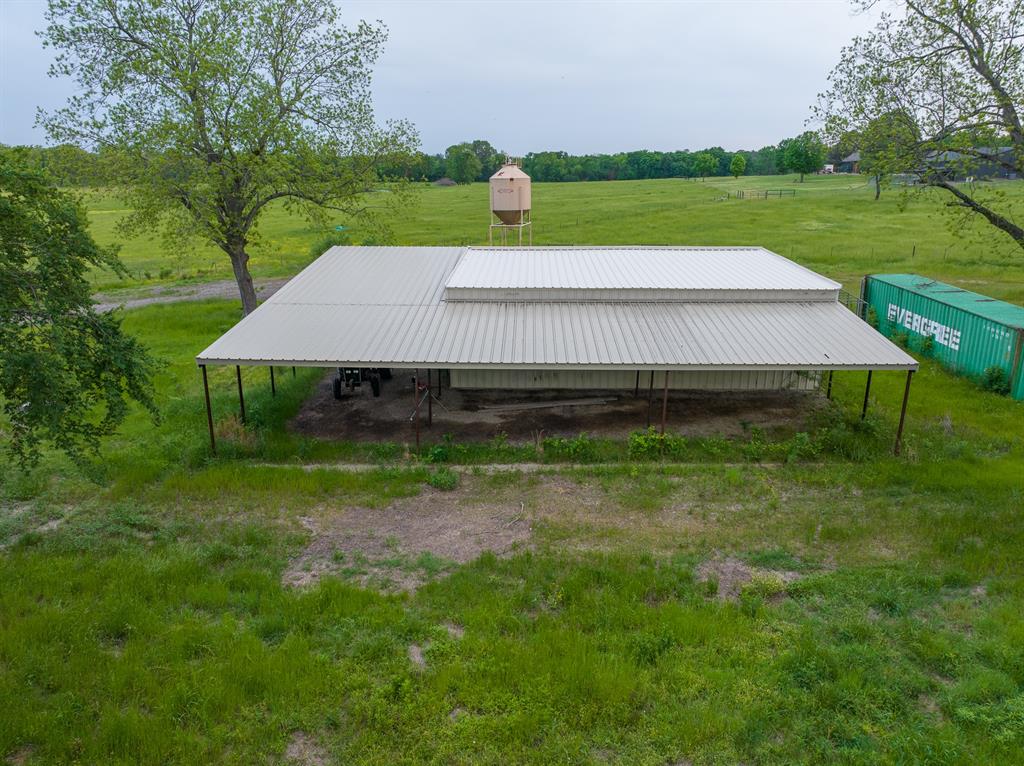 5000 Stillhouse Road Paris, TX 75460 - Photo 37 of 40 a view of a house with a yard