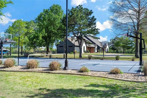 a view of a house with swimming pool and sitting area