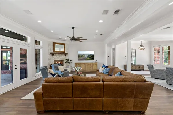 a living room with furniture wooden floor and window