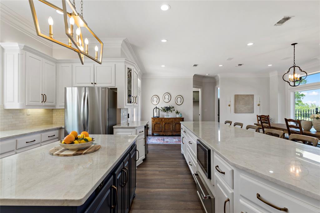 5000 Stillhouse Road Paris, TX 75460 - Photo 10 of 40 a large kitchen with stainless steel appliances lots of counter space and refrigerator