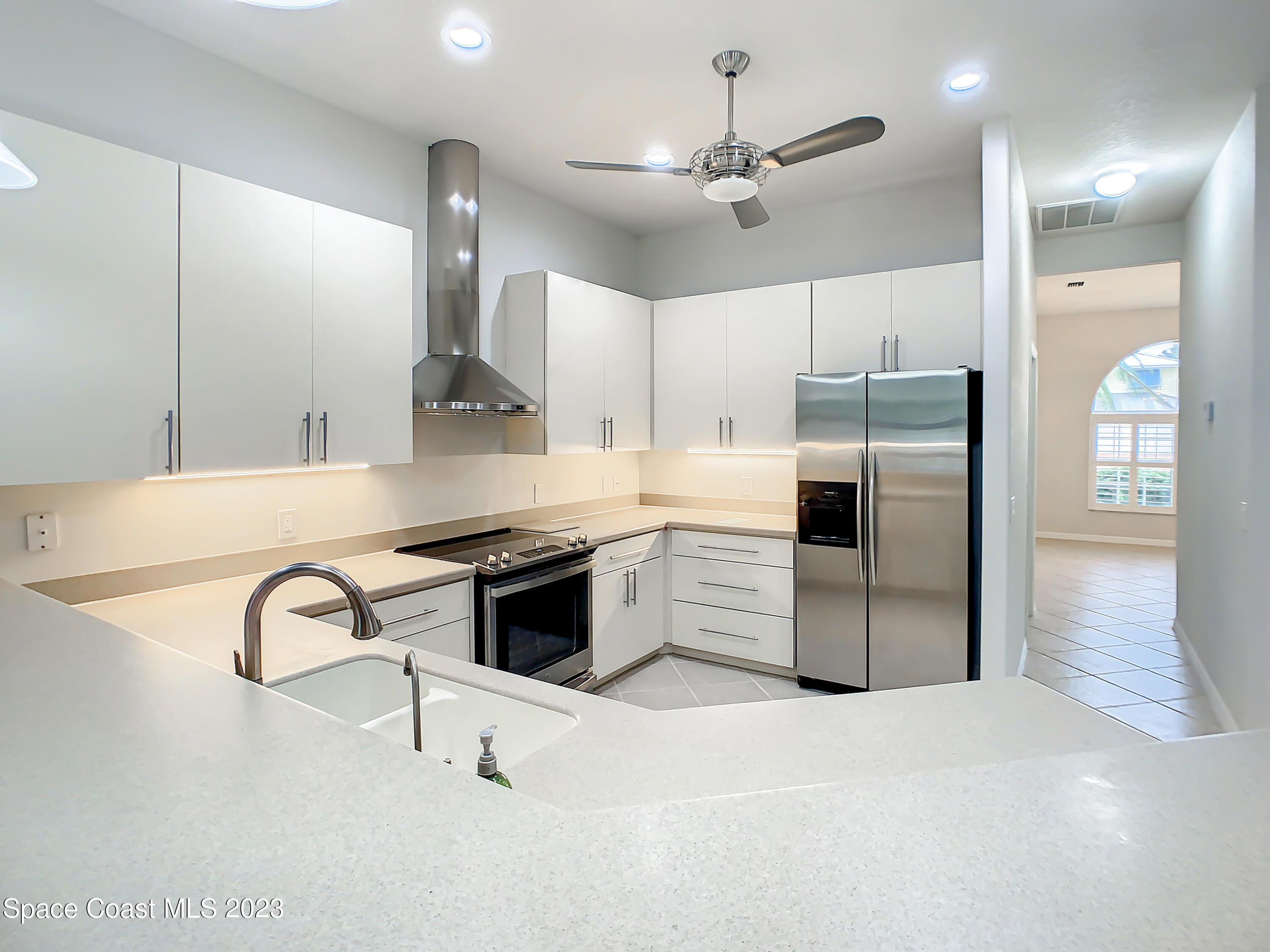 1965 Gates Road Merritt Island, FL 32952 - Photo 15 of 54 a kitchen with stainless steel appliances granite countertop a sink a stove and a refrigerator