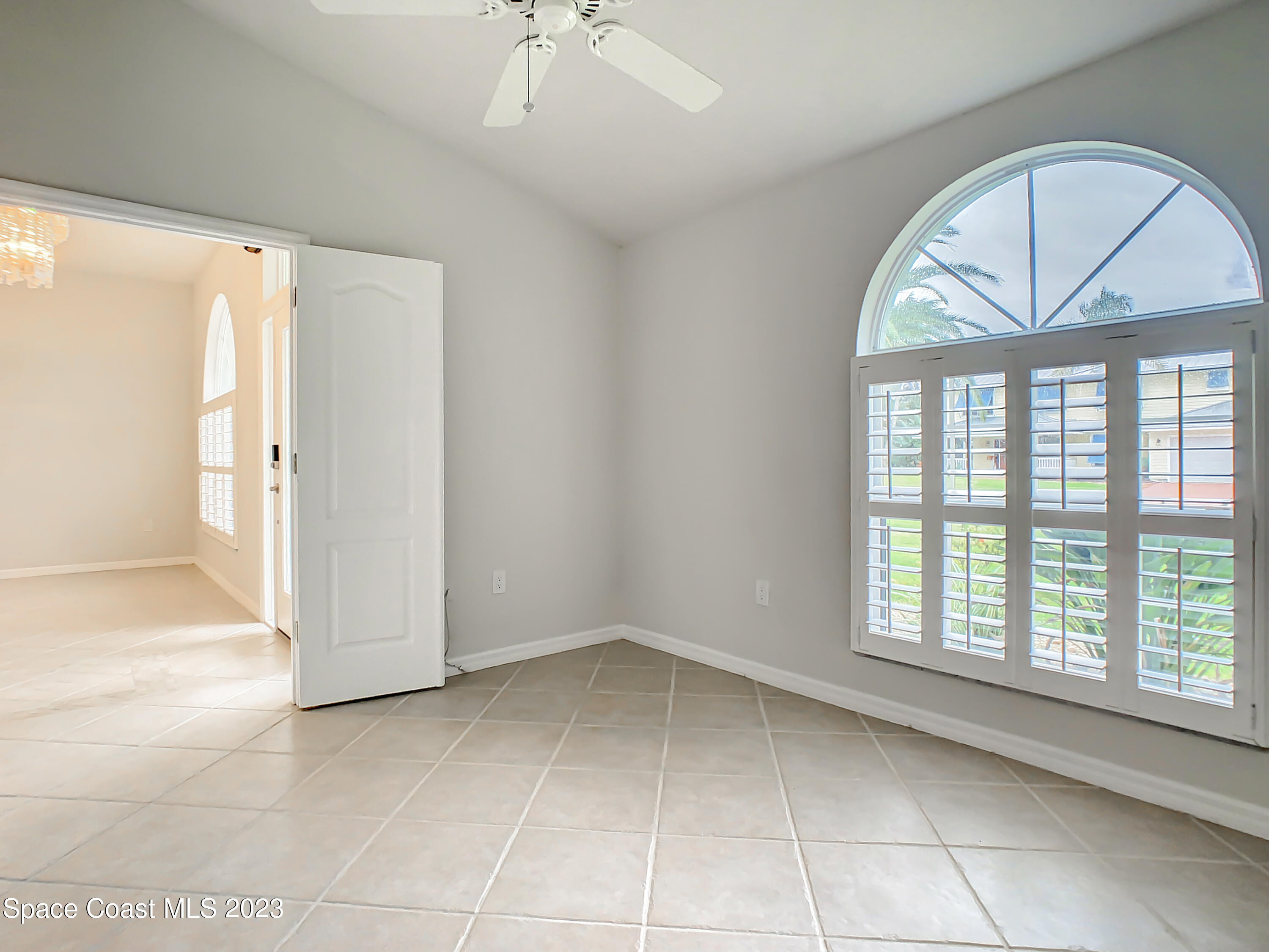 1965 Gates Road Merritt Island, FL 32952 - Photo 19 of 54 a view of an empty room with a window