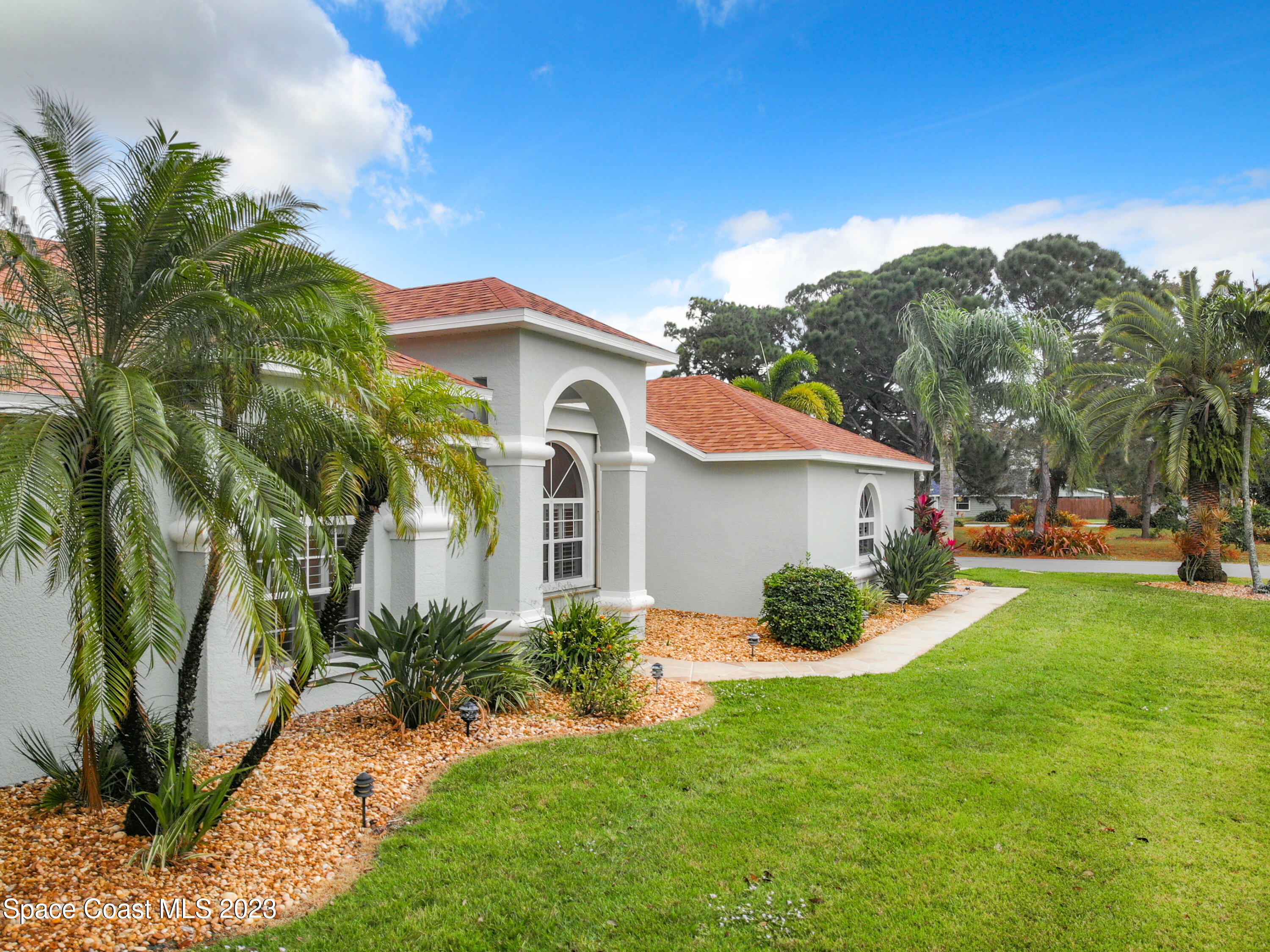 1965 Gates Road Merritt Island, FL 32952 - Photo 2 of 54 a view of a house with a yard