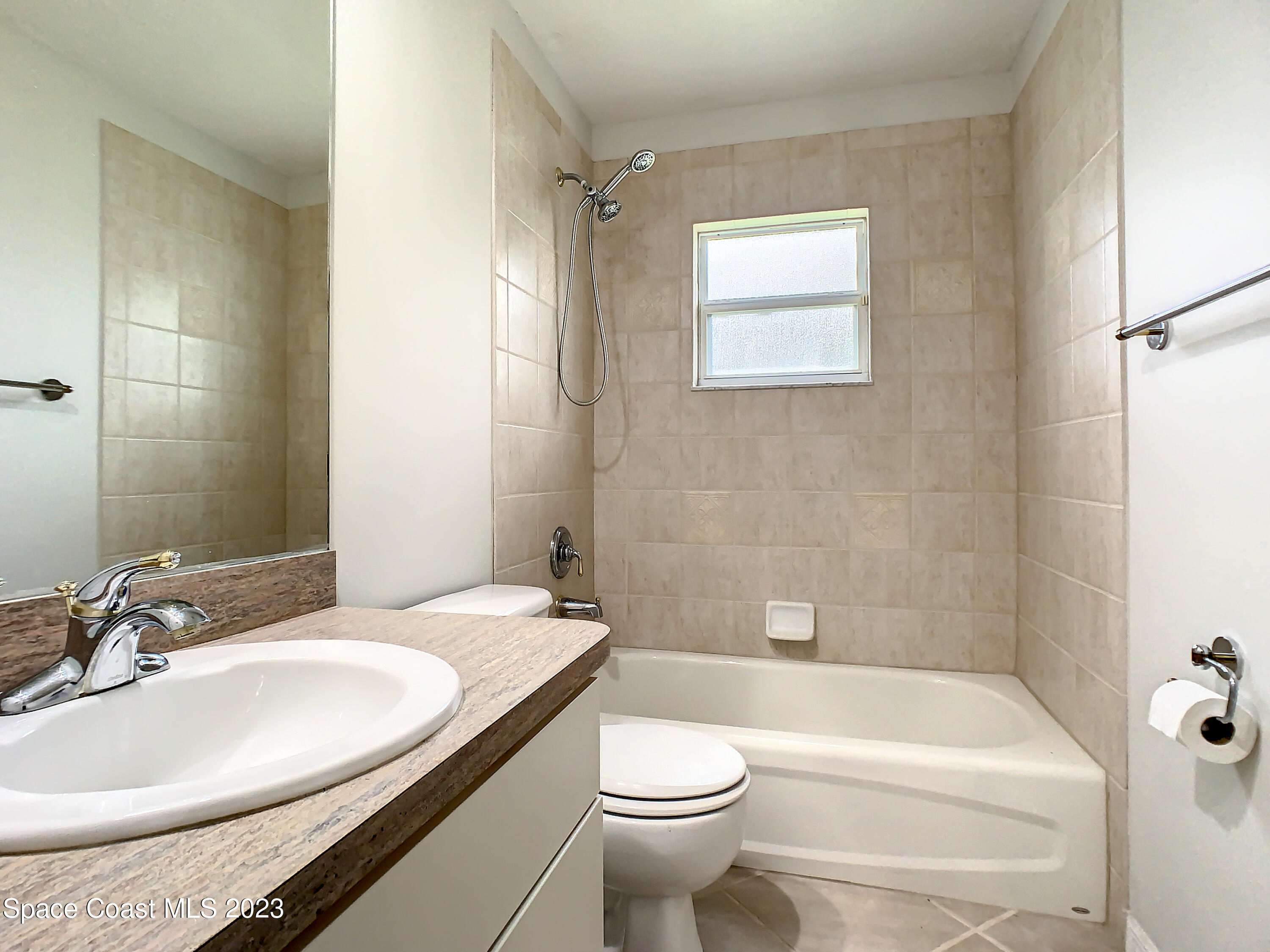 1965 Gates Road Merritt Island, FL 32952 - Photo 24 of 54 a bathroom with a sink a toilet and shower