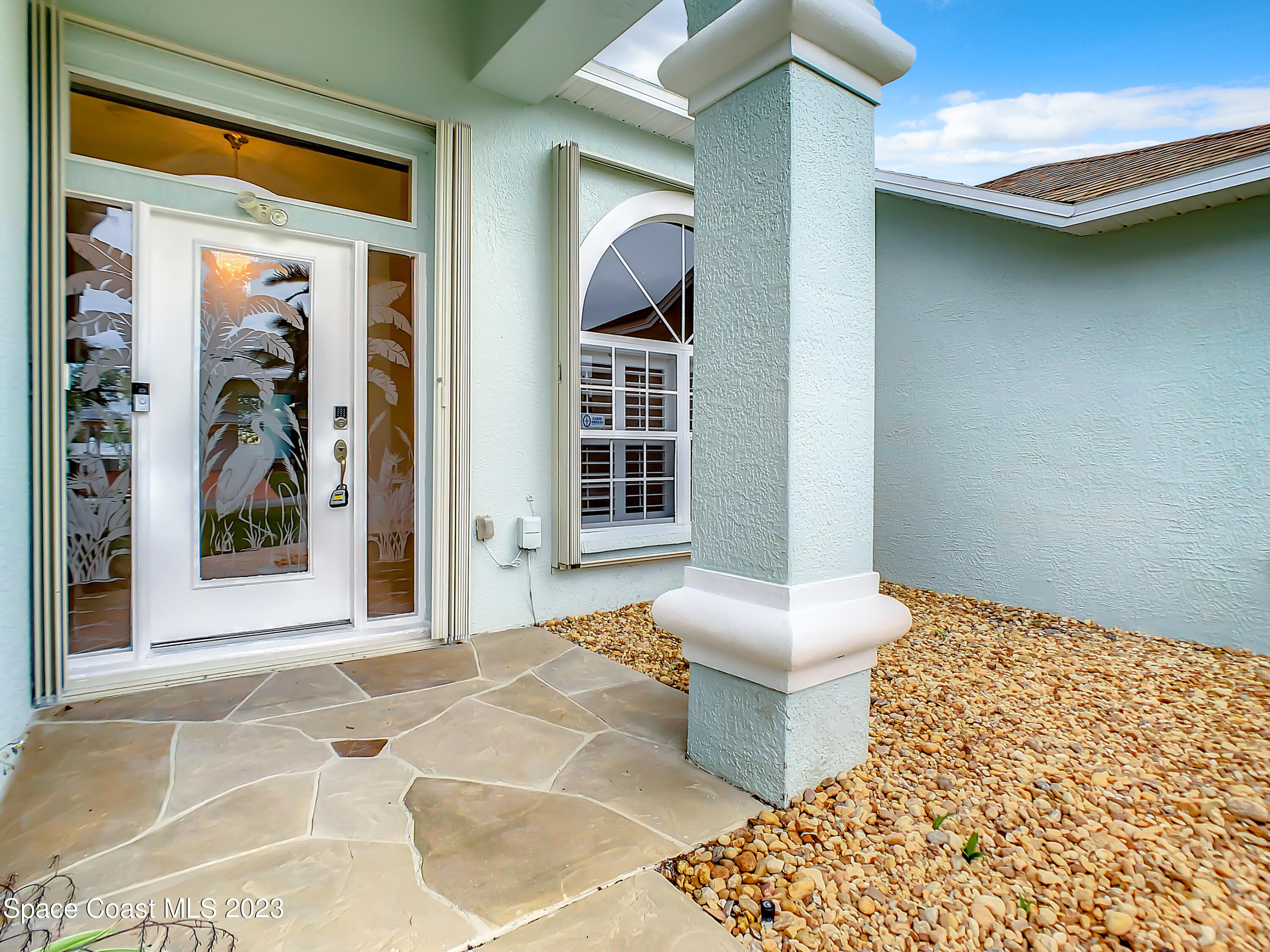 1965 Gates Road Merritt Island, FL 32952 - Photo 3 of 54 a living room with a couch and a rug