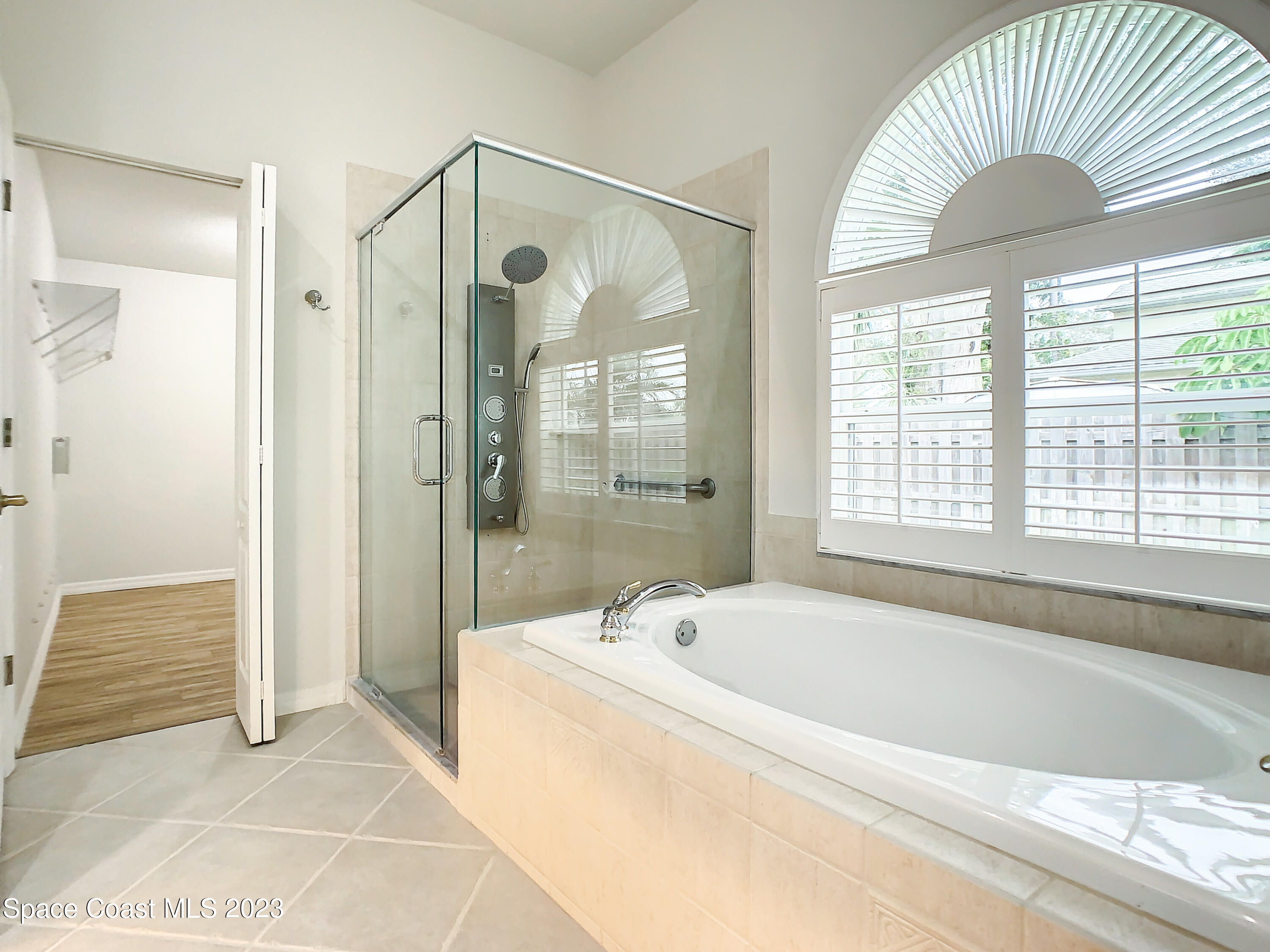 1965 Gates Road Merritt Island, FL 32952 - Photo 32 of 54 a bathroom with a bathtub and a shower