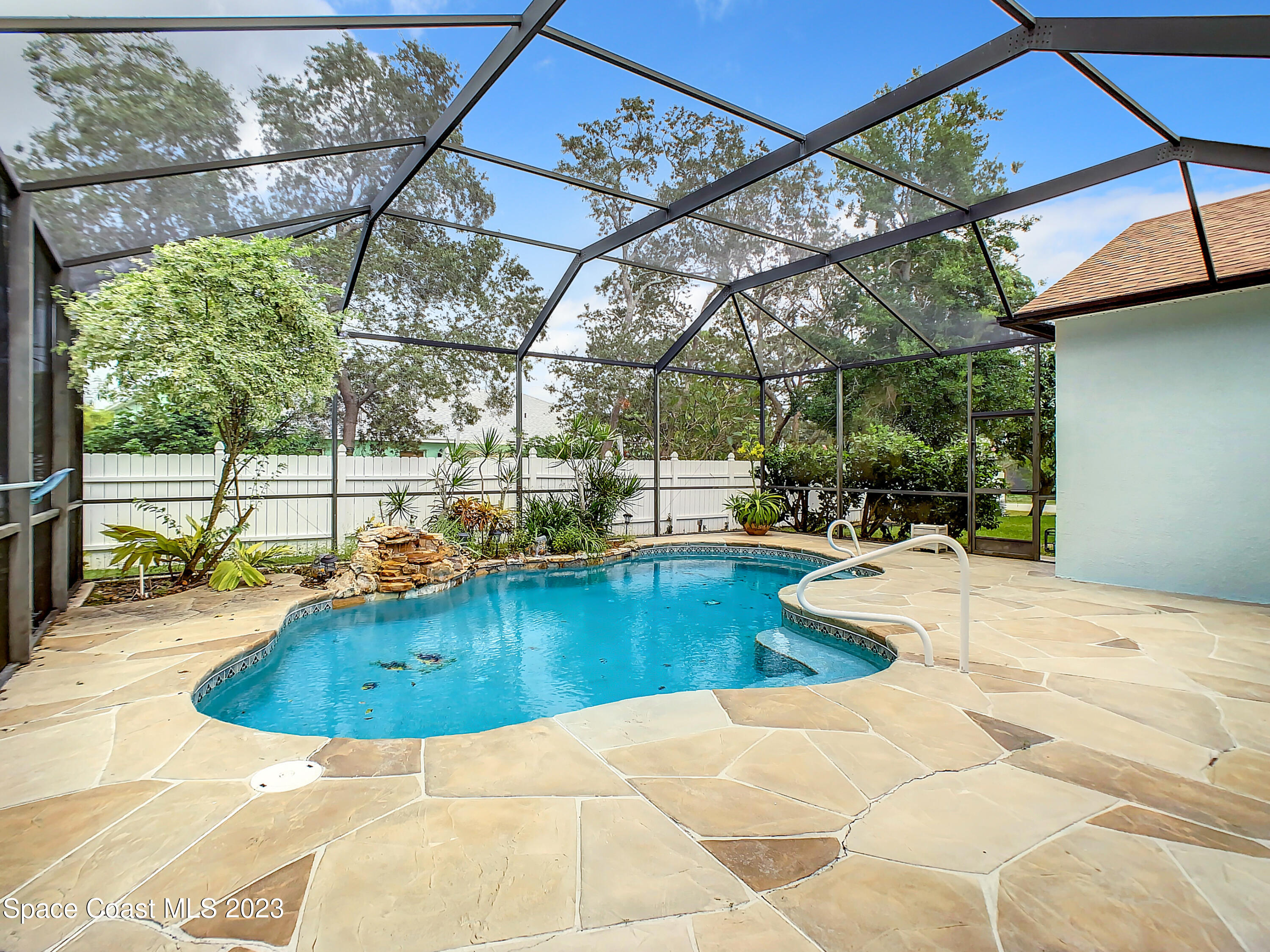 1965 Gates Road Merritt Island, FL 32952 - Photo 39 of 54 a view of a swimming pool with a patio