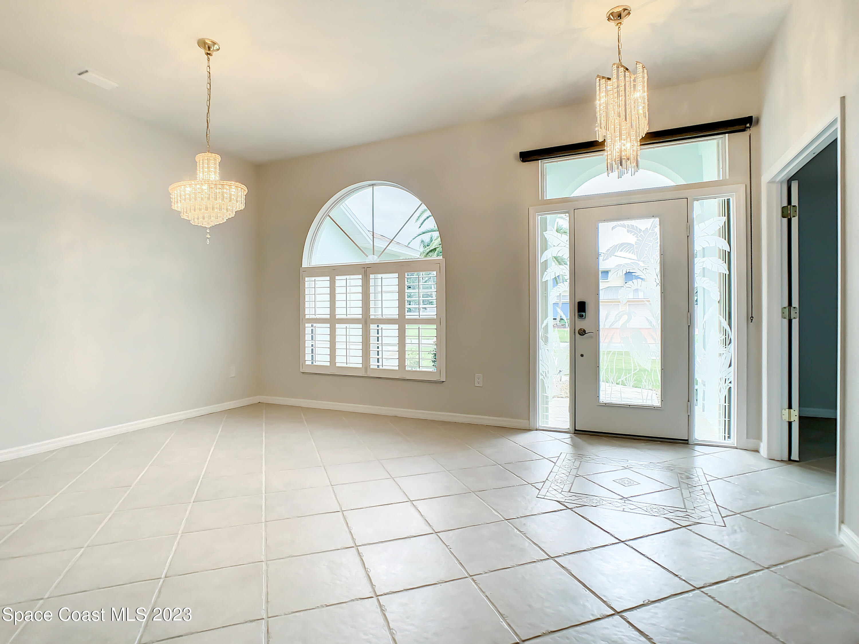 1965 Gates Road Merritt Island, FL 32952 - Photo 4 of 54 a view of an empty room with a window