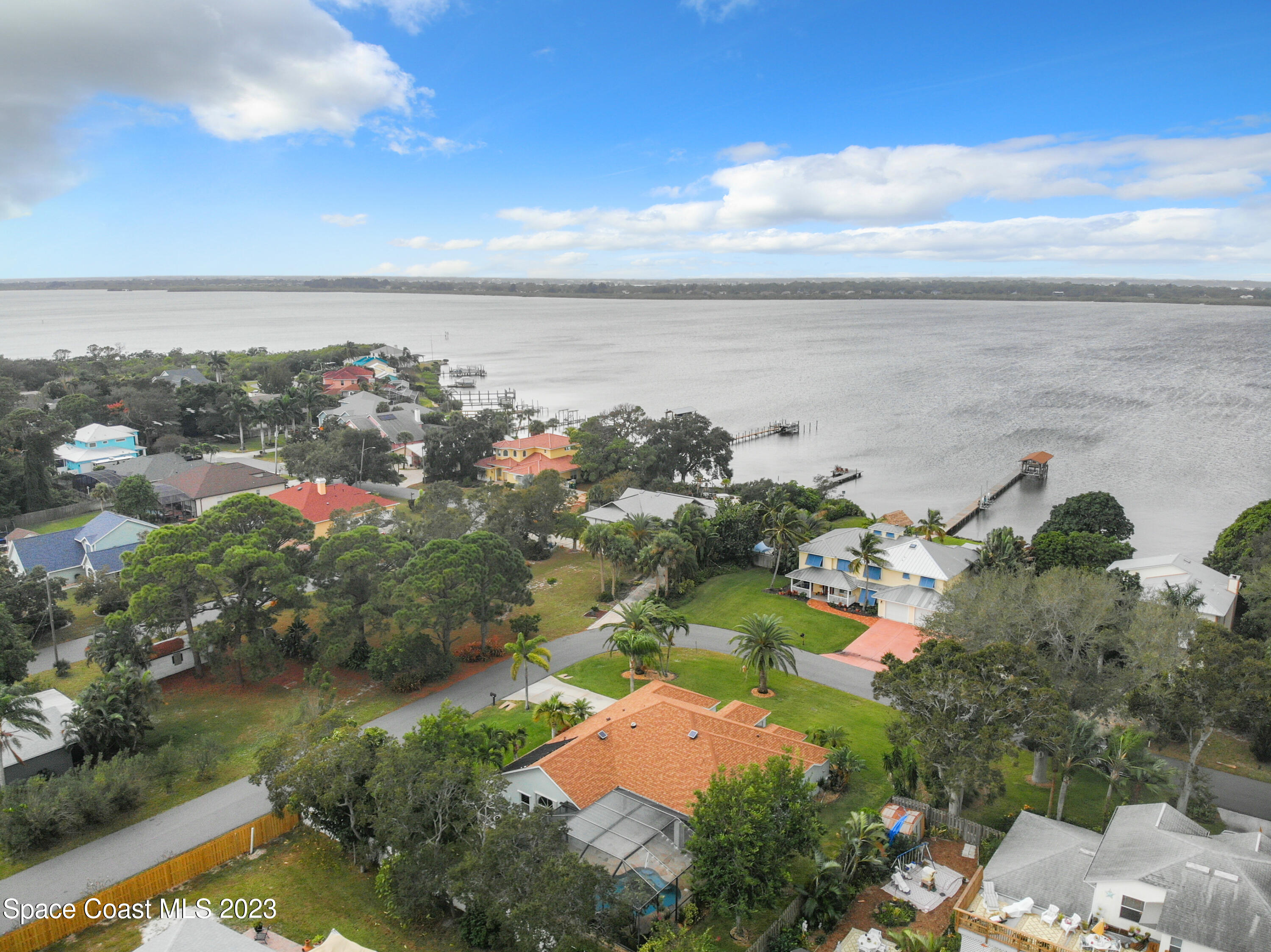 1965 Gates Road Merritt Island, FL 32952 - Photo 45 of 54 an aerial view of ocean and residential houses with outdoor space