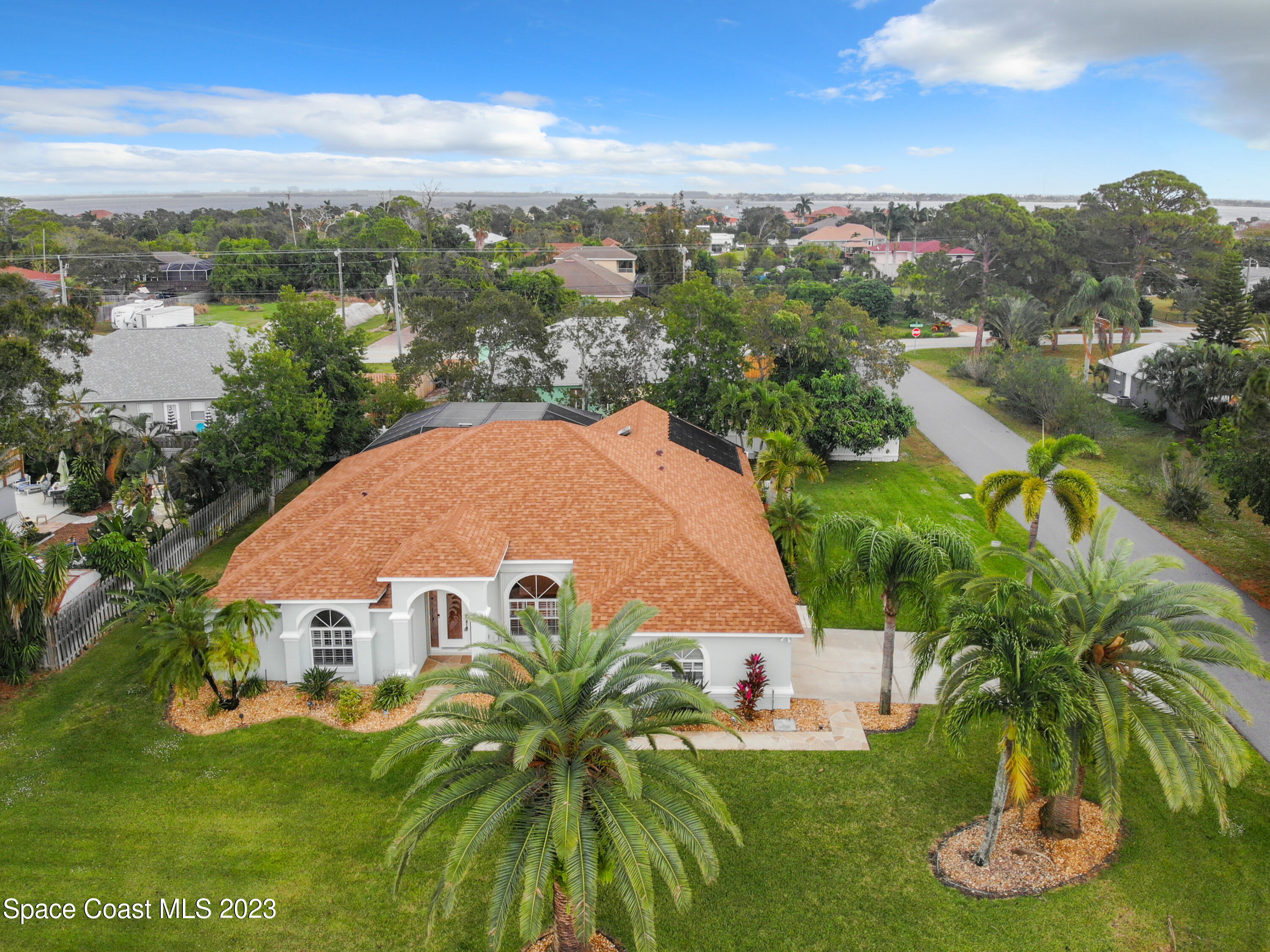 1965 Gates Road Merritt Island, FL 32952 - Photo 50 of 54 an aerial view of residential houses with outdoor space and trees