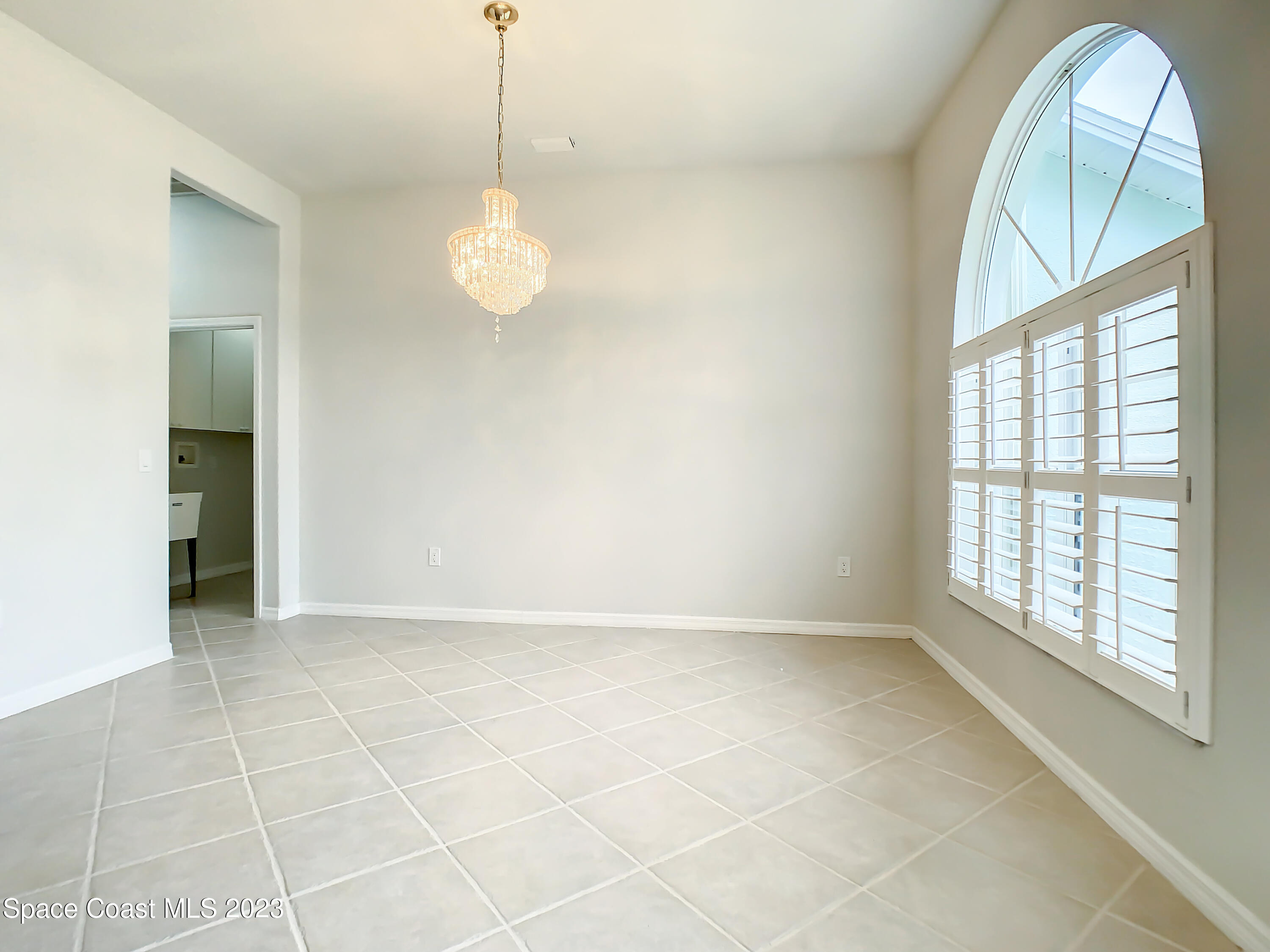 1965 Gates Road Merritt Island, FL 32952 - Photo 5 of 54 a view of an empty room with a window
