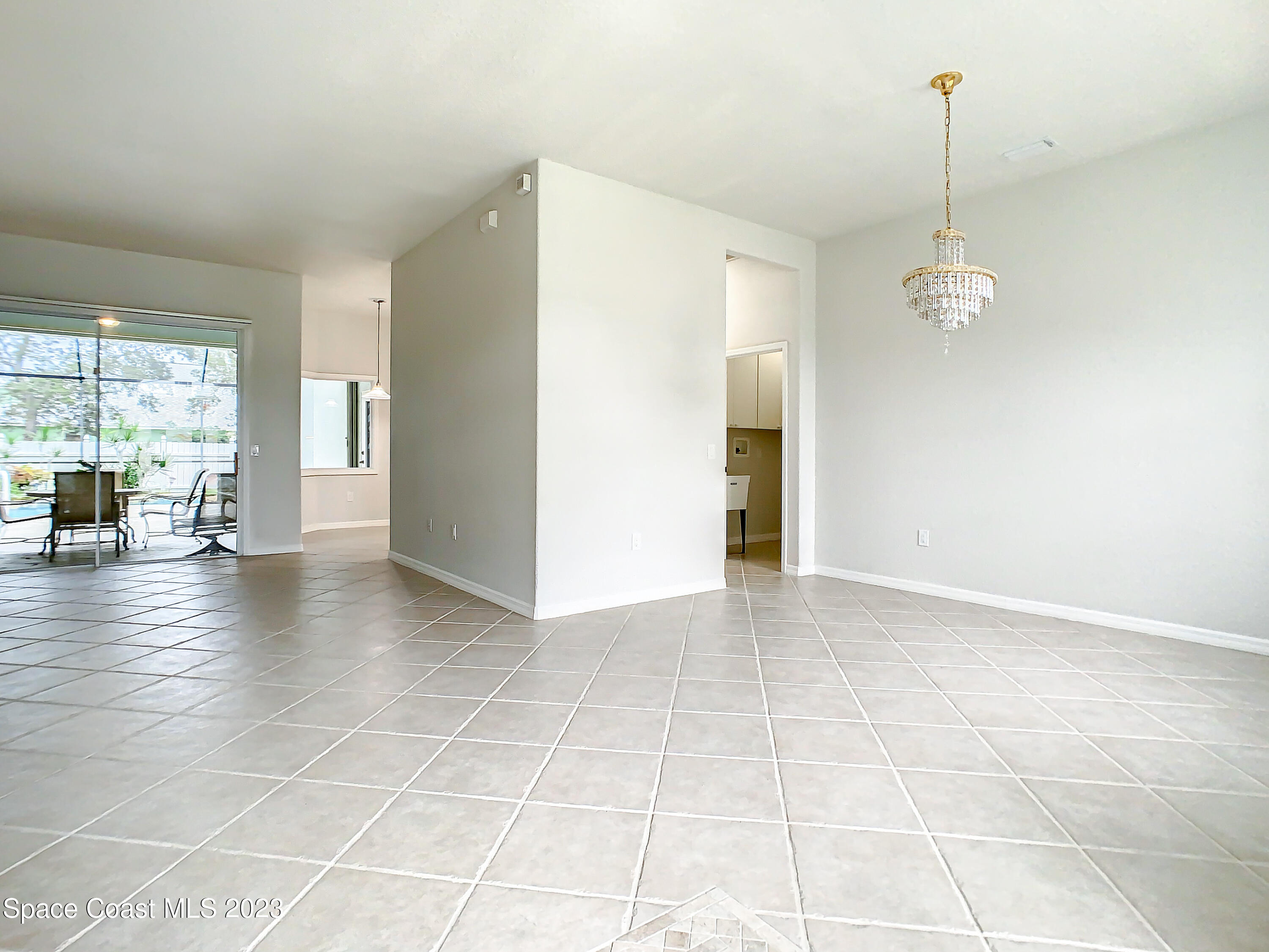 1965 Gates Road Merritt Island, FL 32952 - Photo 6 of 54 a view of a livingroom with furniture window and wooden floor