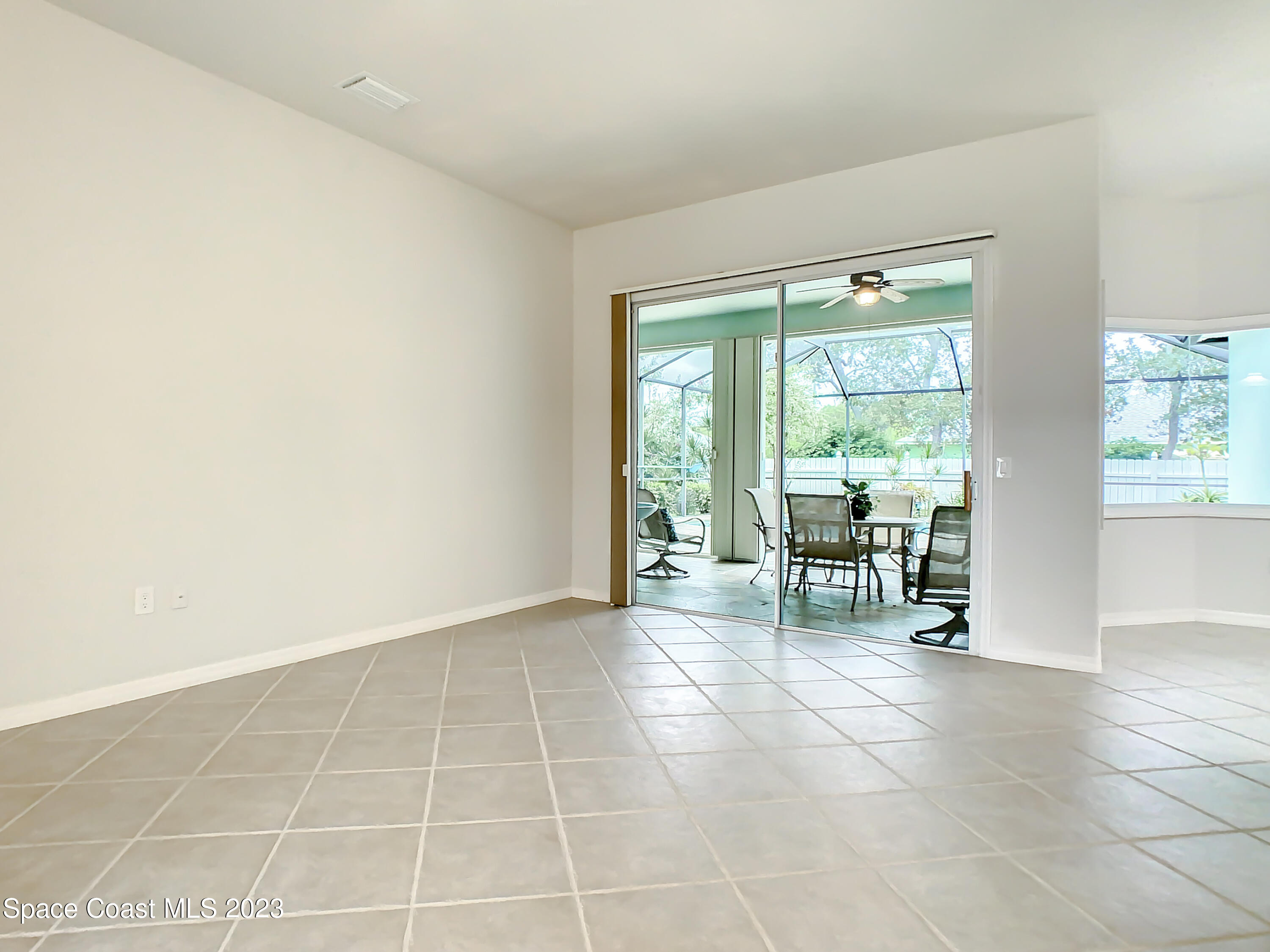 1965 Gates Road Merritt Island, FL 32952 - Photo 8 of 54 a view of an empty room with a window