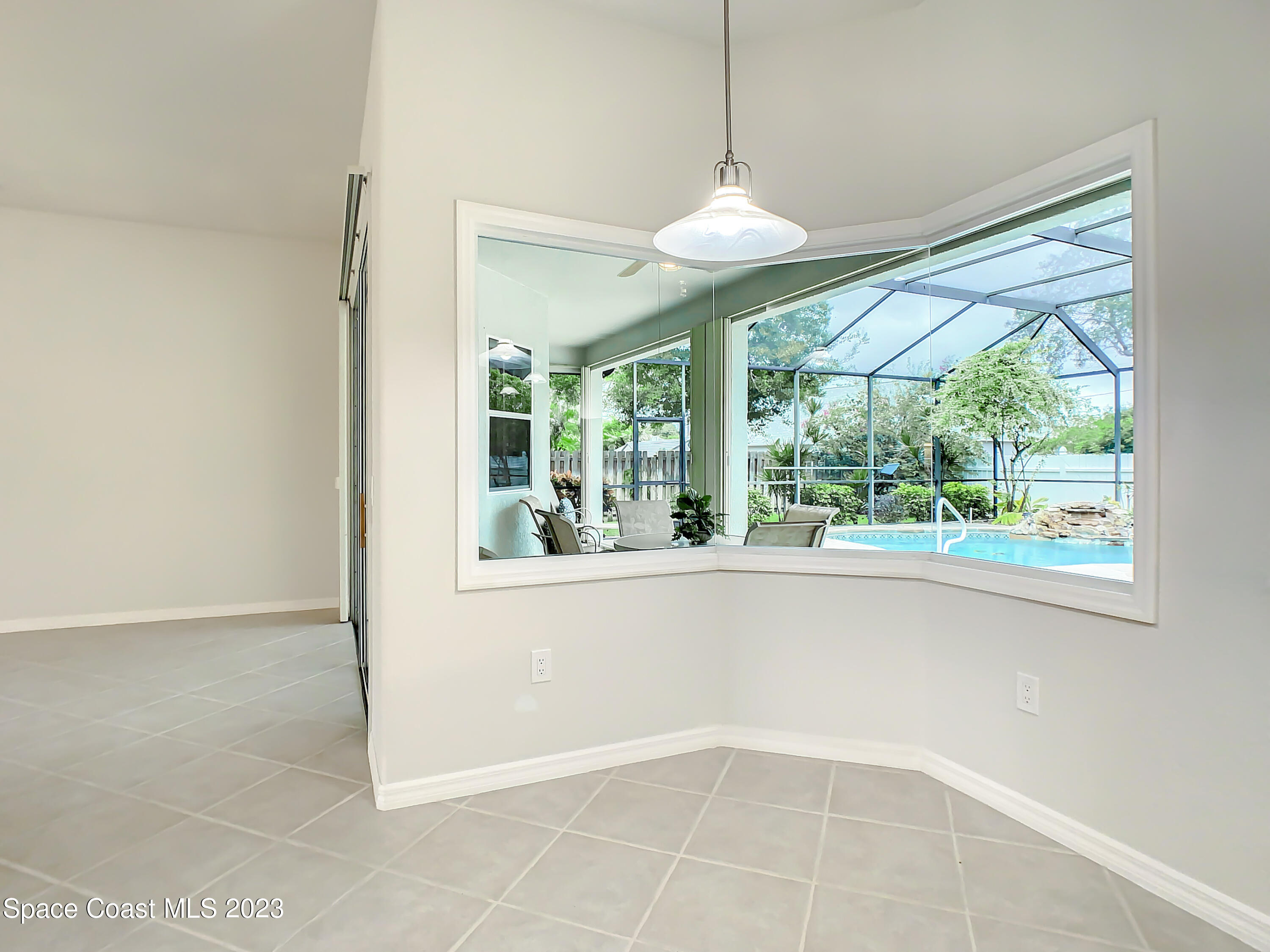 1965 Gates Road Merritt Island, FL 32952 - Photo 9 of 54 a view of an empty room with a window