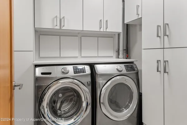 a utility room with dryer and washer