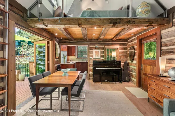 a dining room with a table and chairs