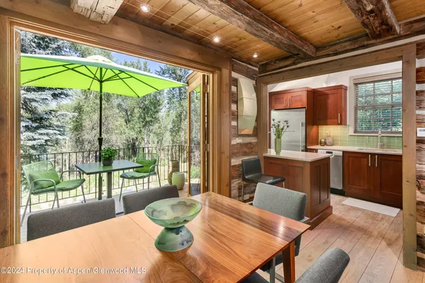 a view of a dining room with furniture window and outside view