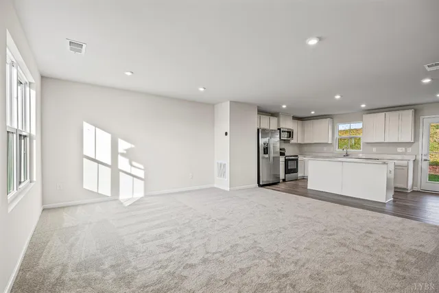 a view of a kitchen with a sink and cabinets