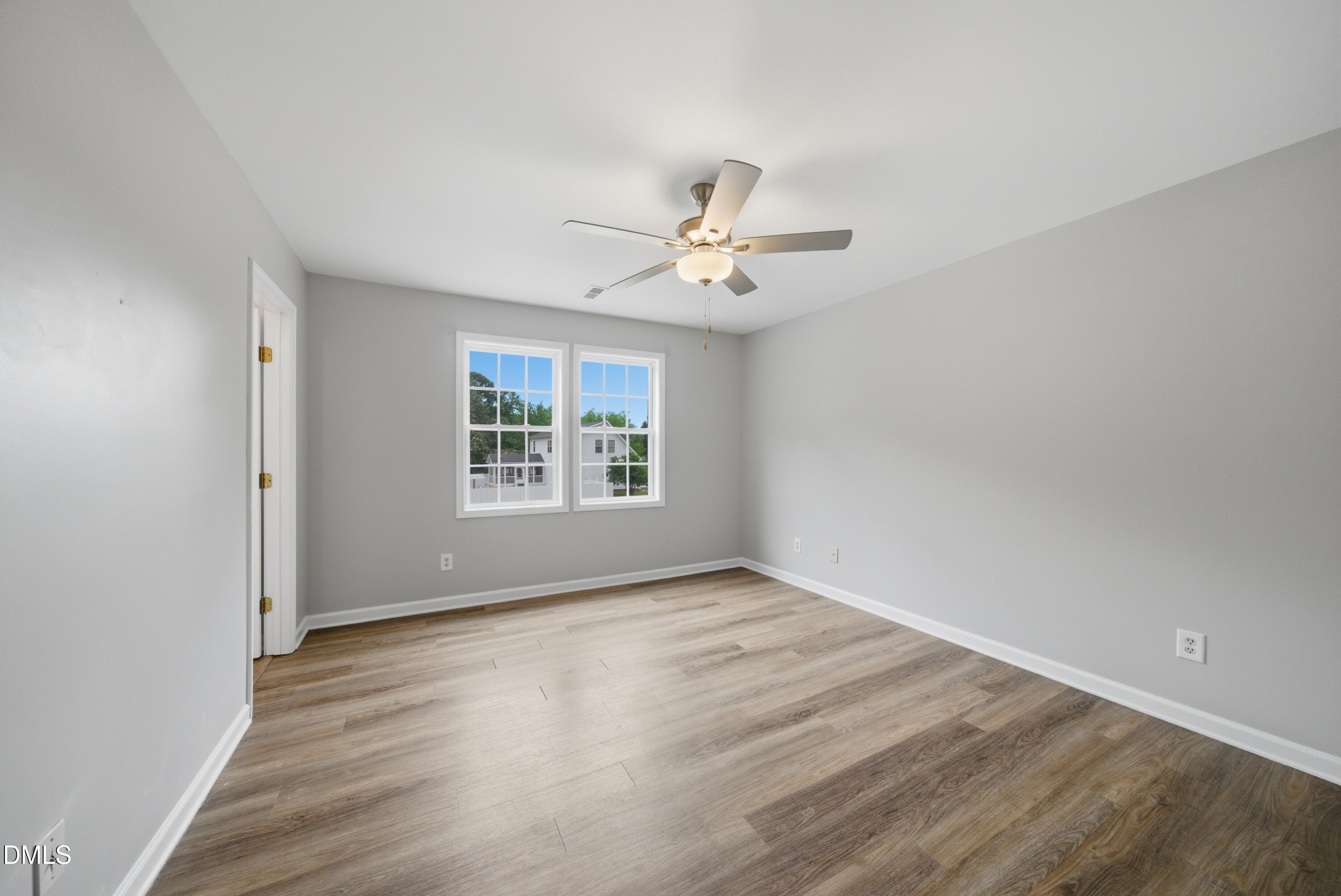 201 Tonylee Court, Unit A Raleigh, NC 27603 - Photo 21 of 30 wooden floor in an empty room with a window