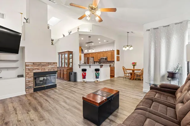 a living room with furniture fireplace and flat screen tv