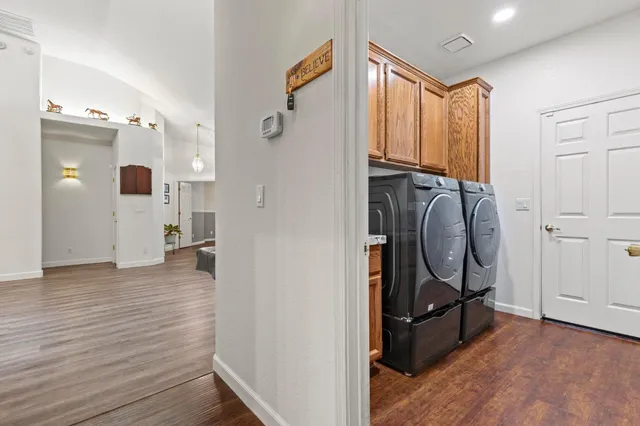 a view of a storage & utility room with wooden floor