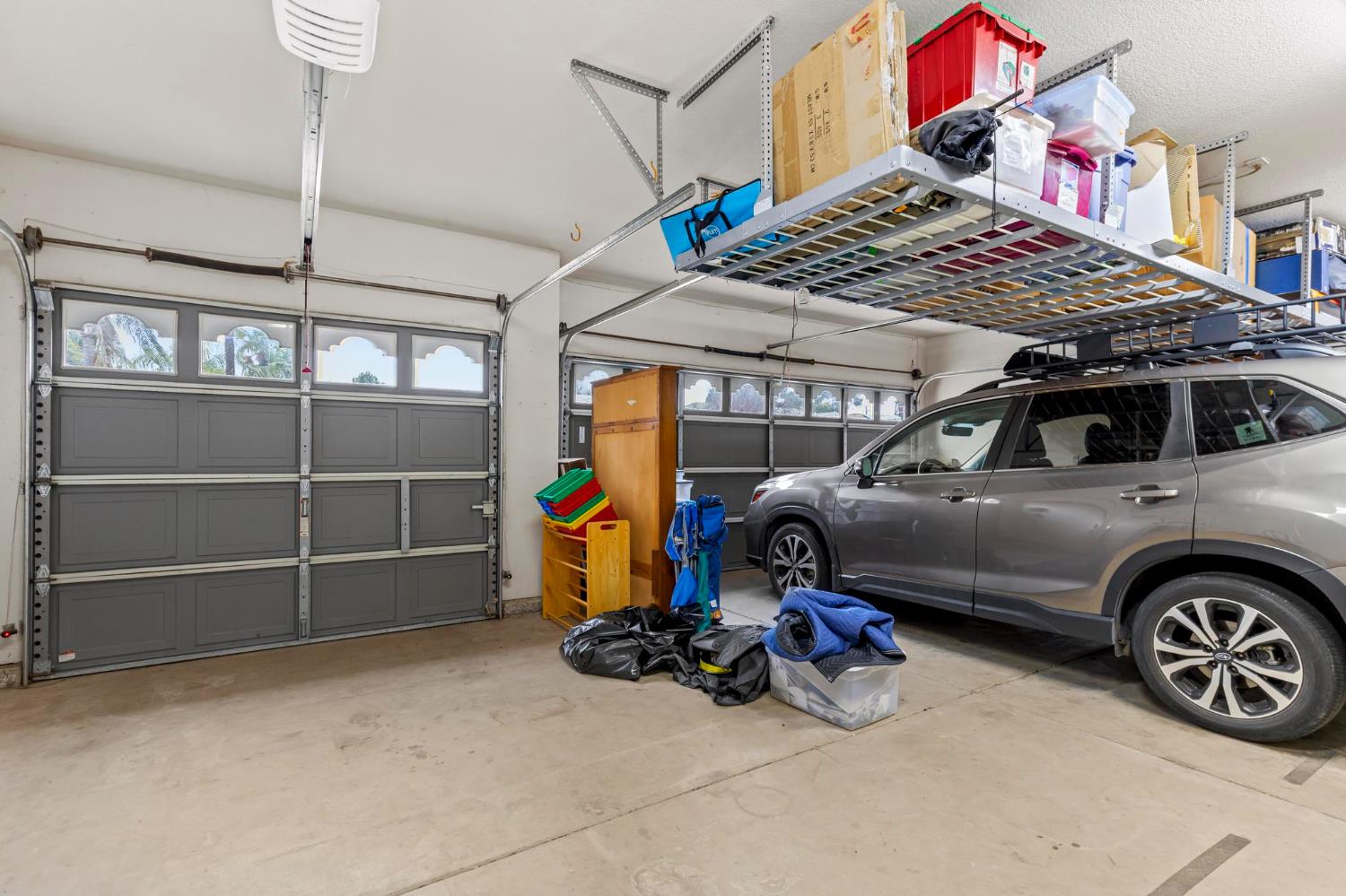 1090 Portola Valley Road Yuba City, CA 95993 - Photo 32 of 42 a view of a garage with parked cars