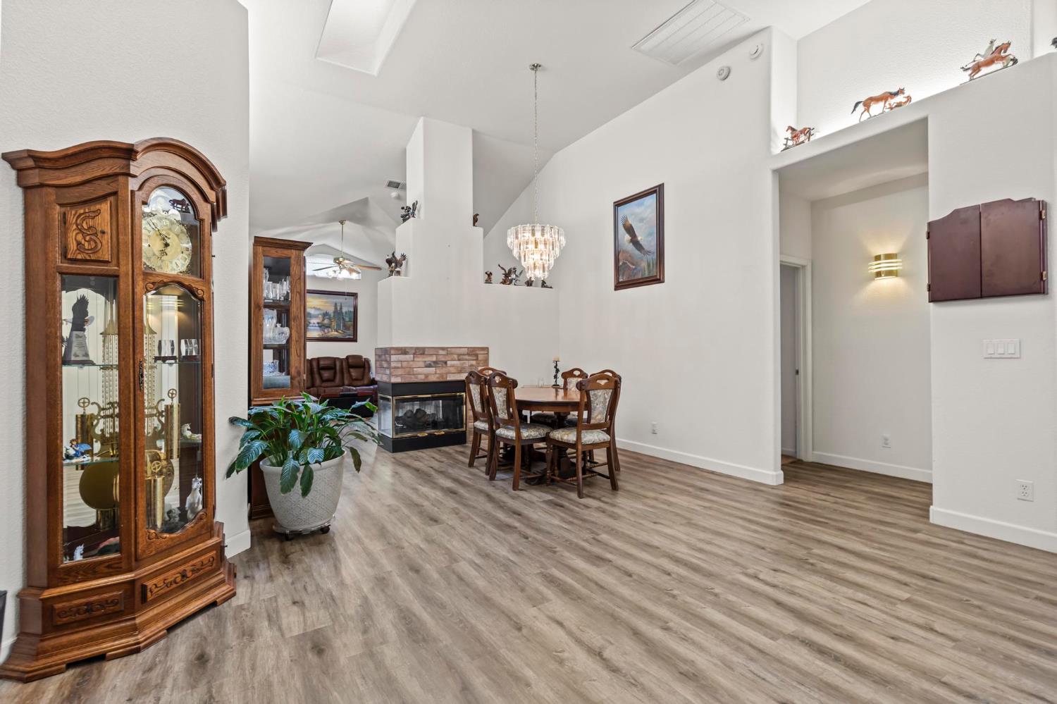 1090 Portola Valley Road Yuba City, CA 95993 - Photo 4 of 42 a view of a dining room with furniture window and wooden floor