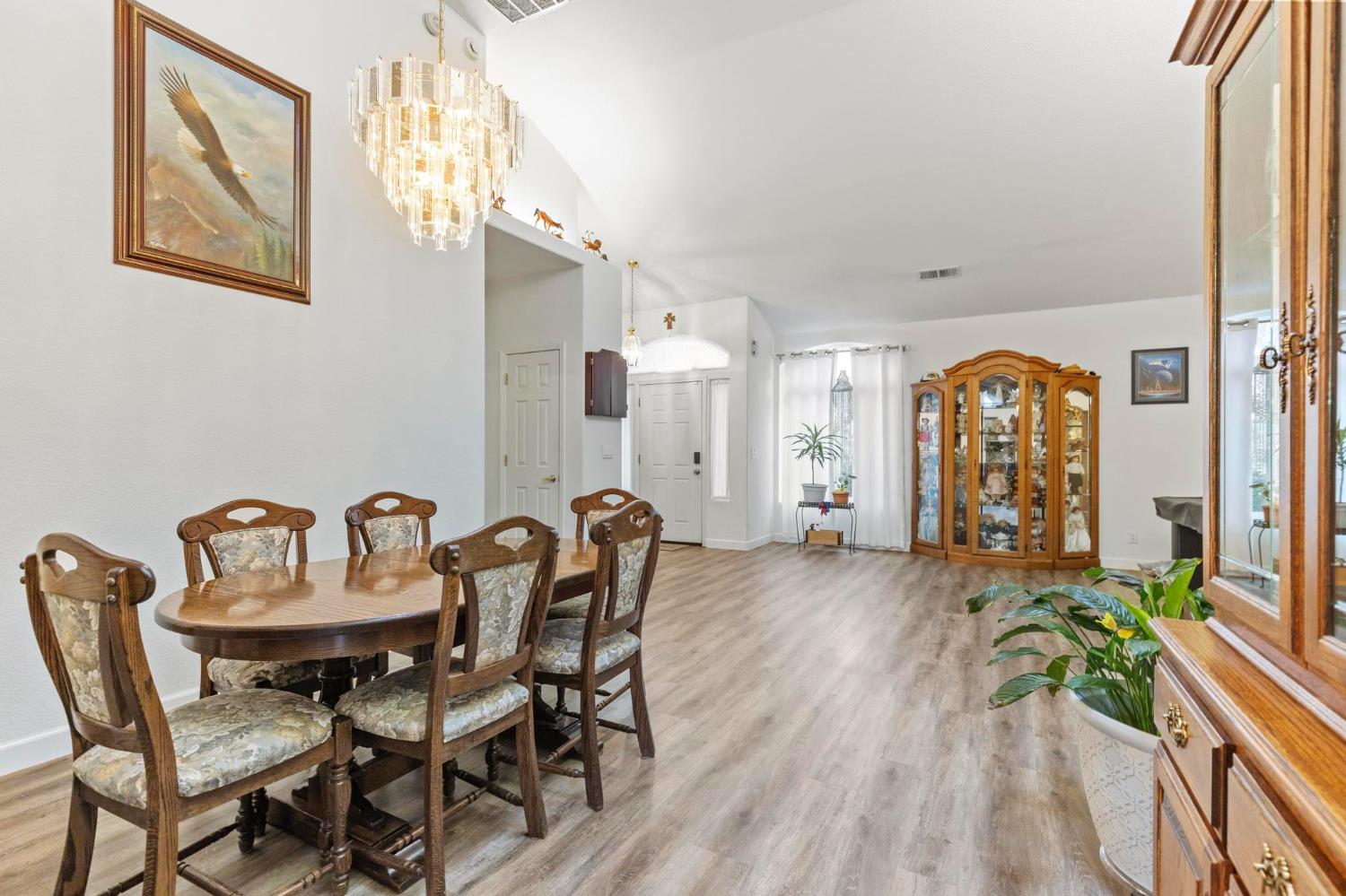 1090 Portola Valley Road Yuba City, CA 95993 - Photo 8 of 42 a view of a a dining room with furniture window and wooden floor