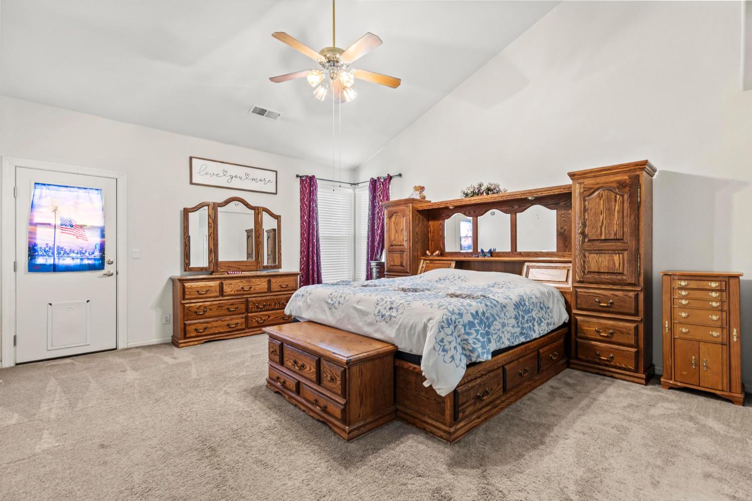 1090 Portola Valley Road Yuba City, CA 95993 - Photo 10 of 42 a spacious bedroom with a bed dresser and a baby crib