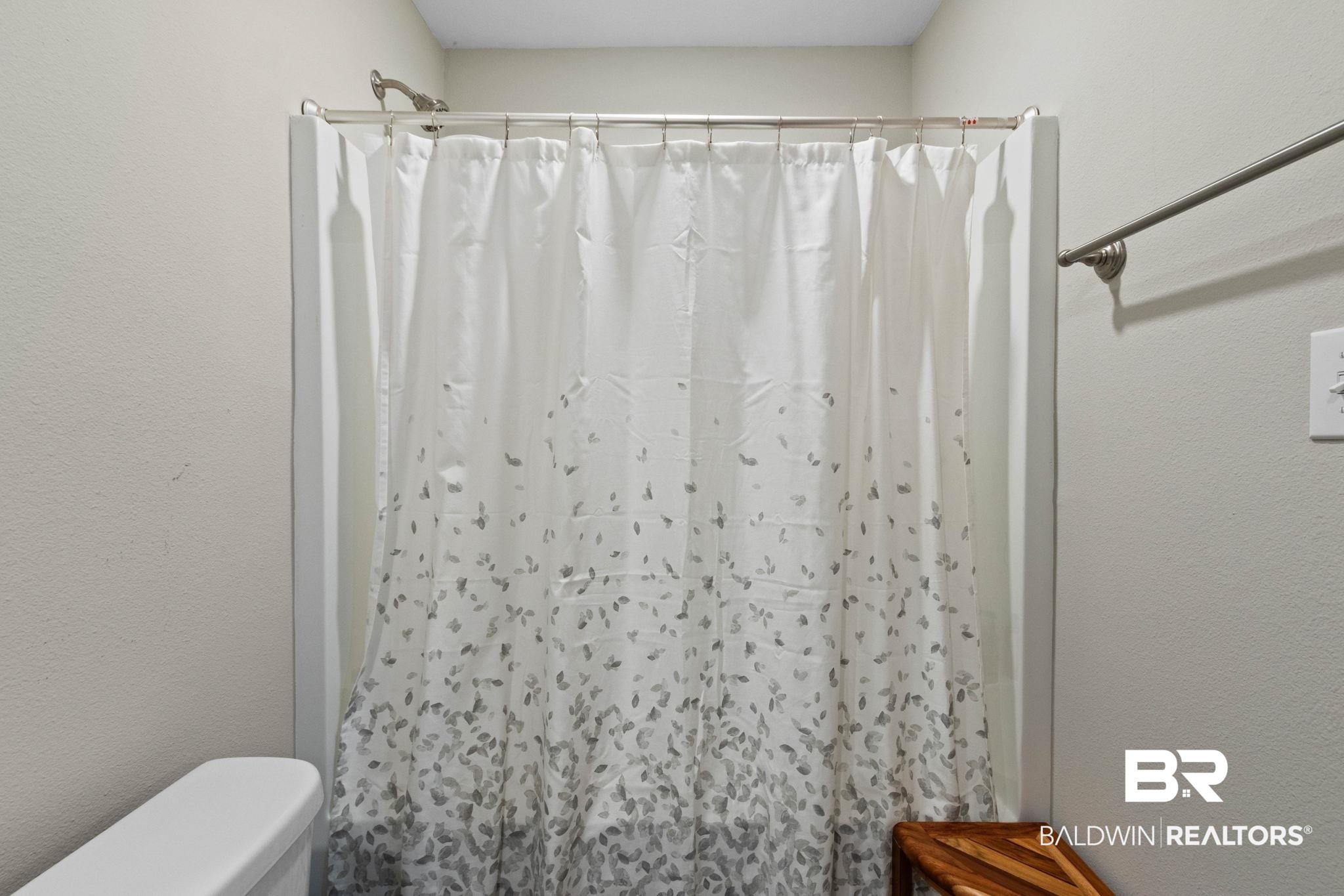 1203 Hayward Loop Foley, AL 36535 - Photo 30 of 41 Full bathroom featuring a textured wall and curtained shower