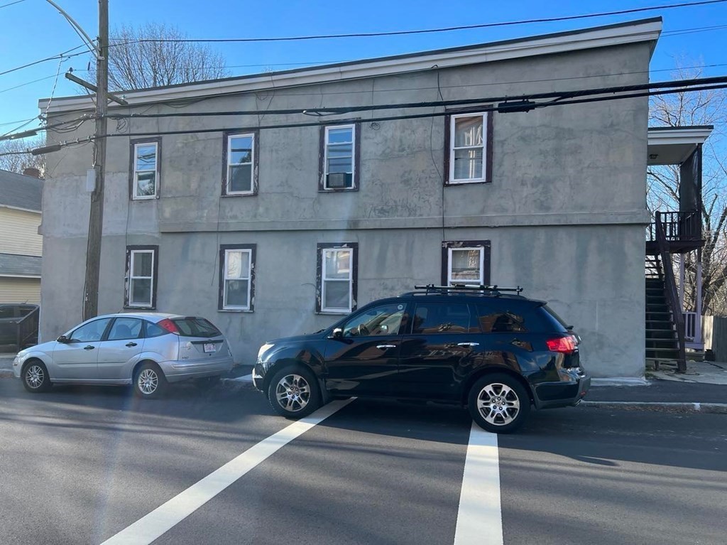 a view of a car parked in front of a house